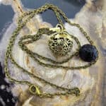 Aroma ketting vlinder brons parfum medaillon lavasteen