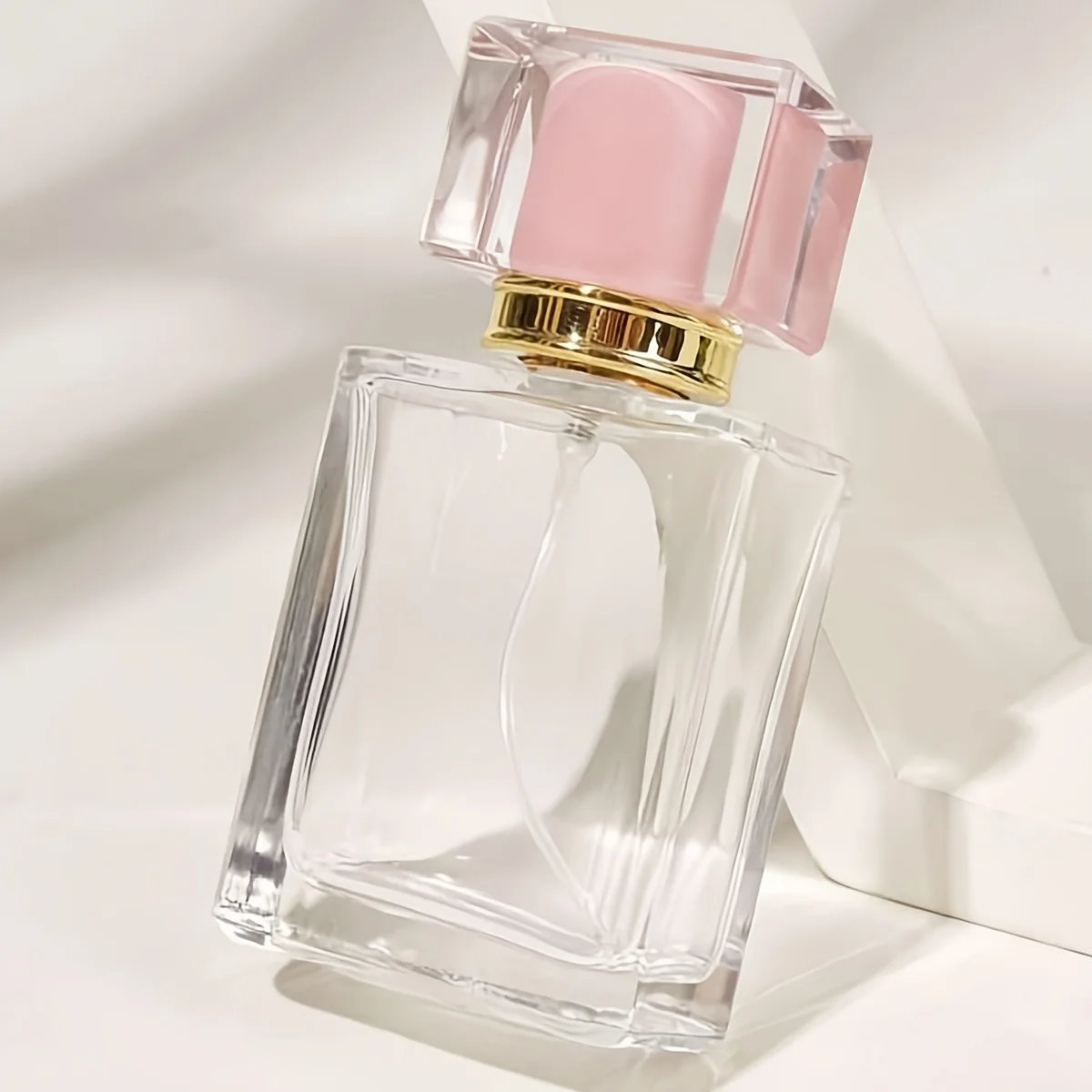 lege-parfumfles-helder-glas-50ml-sprayfles-dop-roze Lege Parfumfles helder glas 50ml sprayfles dop roze