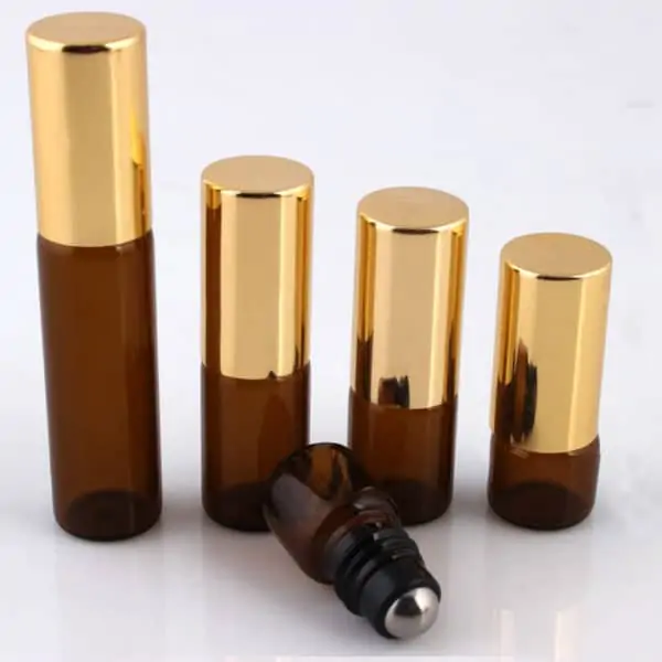 Roller flesjes glas amber bruin lege parfum roll on fles essentiële oliën gouden dop